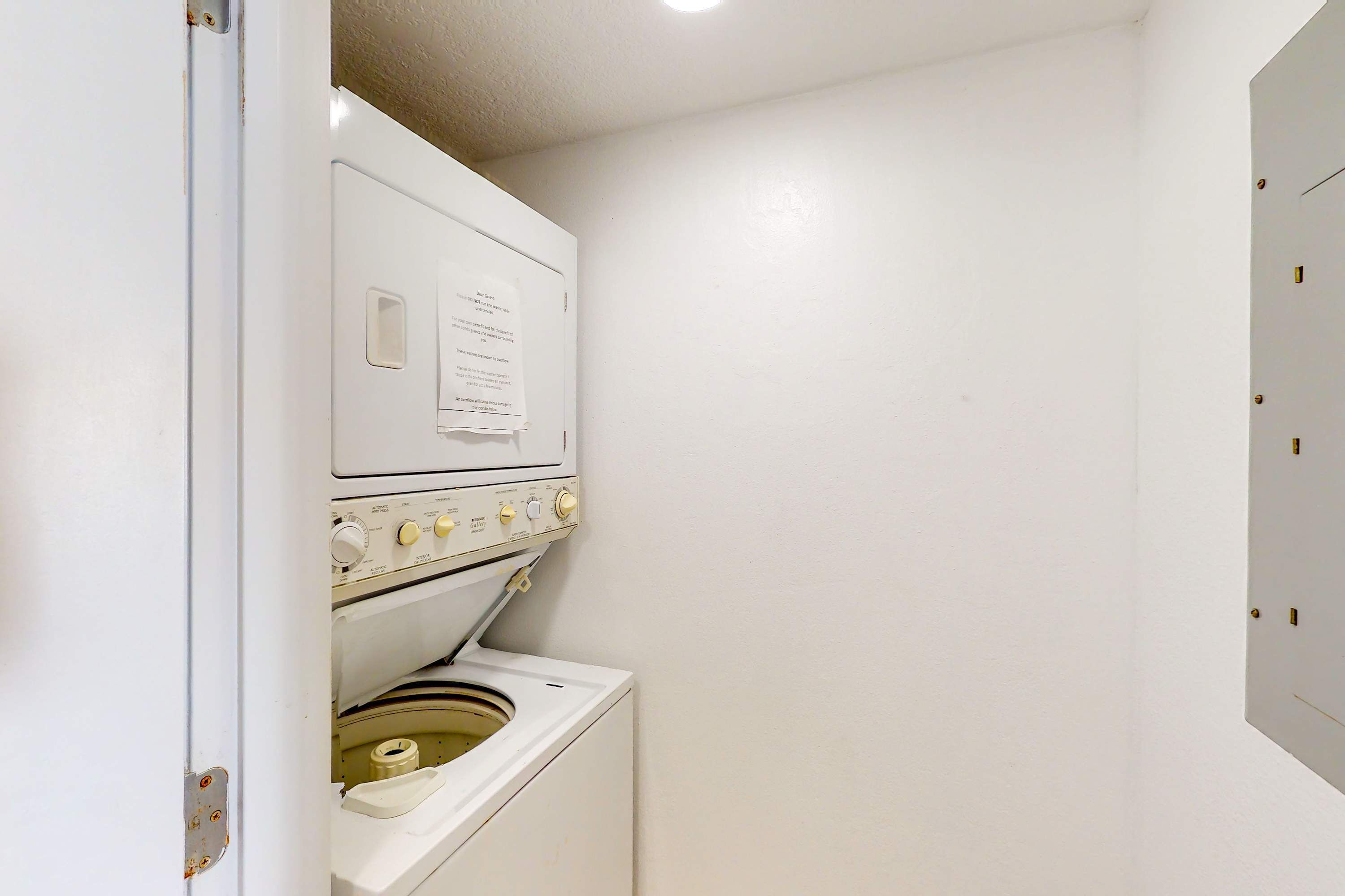A compact laundry room with a washing machine and dryer.