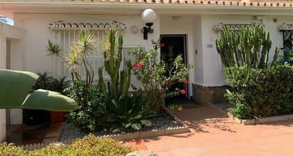 Charming Beachfront Bungalow in Torrox Costa - Perfect Family Retreat