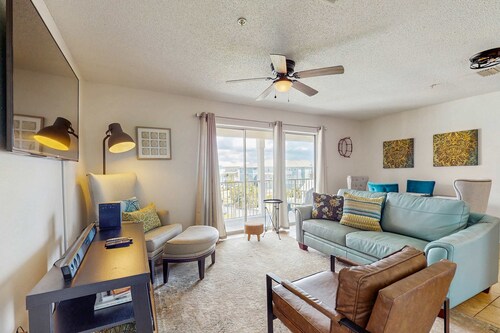 Beautiful condo with water-view, pool, balcony, central AC, & washer and dryer