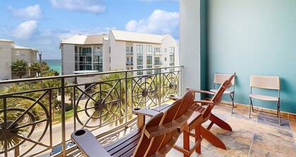 Spacious condo with large living area, private balcony & shared pool