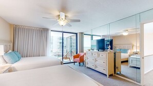 A hotel room with two beds, a TV, a dresser, and a large mirror. - Spacious, beachfront home w/ shared outdoor pool, hot tub, & beach access (Miramar Beach)