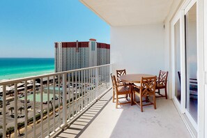 Outdoor dining - Gulf-view condo steps to beach with balcony, pools, hot tub & gym (Panama City Beach)