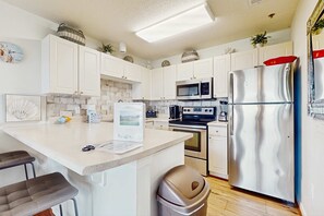 Fridge, microwave, oven, stovetop - Fourth-floor, Caribbean corner condo with ocean views, pool, & hot tub (Santa Rosa Beach)