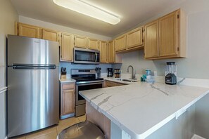 Fridge, microwave, oven, stovetop - Beachfront 2nd floor condo with private balcony, shared pool/hot tub/BBQ (Miramar Beach)