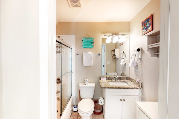 A bathroom with a shower, toilet, sink, and a towel rack. - Beachy condo with free WiFi & shared pools, hot tub - short walk to the beach (Santa Rosa Beach)