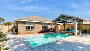 A house with a swimming pool, covered patio, and a fenced backyard. - Coastal Sandy Cay (Miramar Beach)