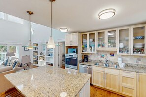 Fridge, microwave, oven, stovetop - Spacious dog-friendly home with community pool, deck, & WiFi - minutes to beach (Cape San Blas)