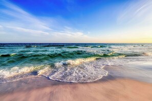 A beach with waves, clear sky, and distant horizon. - Fantastic & spacious coastal condo with a shared pool and on-site golf (Miramar Beach)