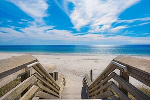 A wooden boardwalk leading to a beach with clear skies and calm waters. - 2nd-floor condo near beach with outdoor pool, tennis, balcony, washer&dryer, AC (Santa Rosa Beach)