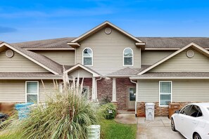 Exterior - Inviting, two-story home with furnished patio, washer/dryer, & pool access (Navarre)