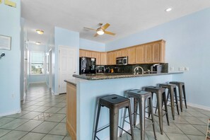 Fridge, microwave, oven, stovetop - Beachfront townhome with ocean views, 2 balconies, W/D, & AC - dog-friendly (Pensacola Beach)