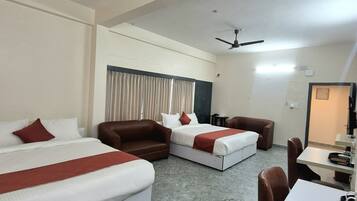 Deluxe Quadruple Room, Garden View | Desk, laptop workspace, free WiFi