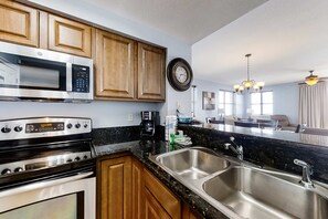 Fridge, microwave, oven, stovetop - Spacious 18th-floor condo with furnished balcony, shared heated pool, gym, & more (Miramar Beach)