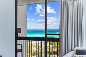 A balcony with a view of the ocean and a beach. - Ocean-view condo at SunDestin with pool, hot tub, sauna, and walkable locale (Destin)
