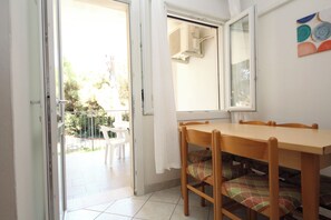 Apartment, 2 Bedrooms, Patio, Garden View | Dining room - Cozy Apartment Near the Beach in Rosolina (Rosolina)