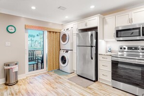 Fridge, microwave, oven, stovetop - Three-story condo in beachfront complex with patios, balconies, pool & hot tub (Panama City Beach)