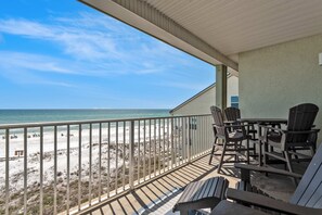 Outdoor dining - Stylish oceanfront condo w/ pool access, private W/D, ocean views, & central AC (Santa Rosa Beach)