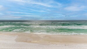 A beach with waves and a clear sky. - Gorgeous Blue Mountain Beach Condo with views of the Gulf (Santa Rosa Beach)