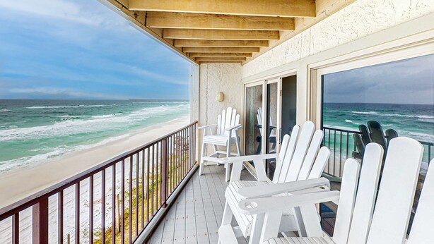 A balcony with white chairs overlooking the ocean. - Gorgeous Blue Mountain Beach Condo with views of the Gulf (Santa Rosa Beach)