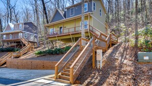 A two-story house with a wooden staircase leading to a balcony. - Blue Ridge Retreat: 1 Mi to Kingwood Golf (Clayton)