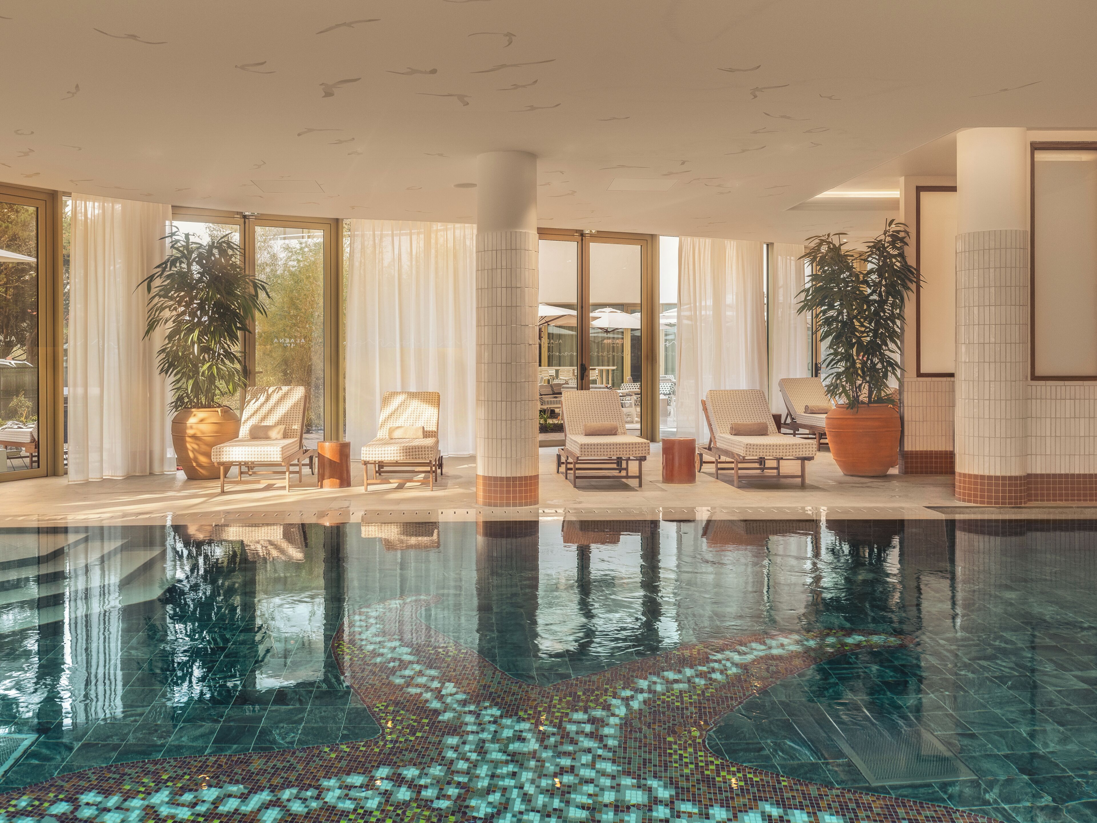 Indoor pool, open 9:00 AM to 8:00 PM, free cabanas, pool umbrellas