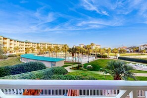 A hotel with multiple floors, a pool area, and well-maintained gardens. - Friendly Condo with Private washer&dryer, High-Speed WiFi, & Beach Access (Miramar Beach)