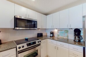 Fridge, microwave, oven, stovetop - Fifth-floor beachfront condo with furnished balcony, pools, hot tub & grills (Panama City Beach)