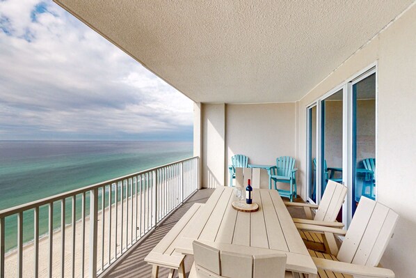 Outdoor dining - Oceanfront condo with scenic balcony, resort amenities, central AC, & W/D (Panama City Beach)