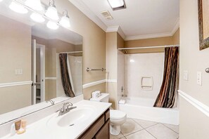 A bathroom with a sink, mirror, toilet, and bathtub. - 3rd Floor Condo Amenities, Beach Access, Beach Equipment Included (Destin)