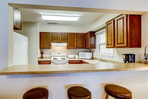 Fridge, microwave, oven, stovetop - Picturesque gulf-front condo on 30A Steps to beach Charcoal grills on-site (Santa Rosa Beach)