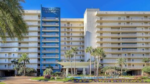 A multi-story hotel with a prominent blue sign reading "STELLING SHORES". - Gulf front penthouse w shared pools, snack shack, community grill & more (Destin)