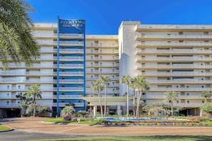 A multi-story hotel with a prominent blue sign reading "STELLING SHORES". - Gulf front penthouse w shared pools, snack shack, community grill & more (Destin)