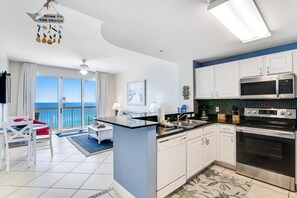 Fridge, microwave, oven, stovetop - Cozy Calypso condo with balcony & view of the Gulf & Pool (Panama City Beach)