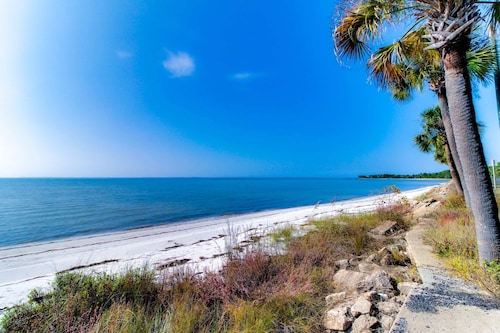 Dog-friendly 2BR home with screened porch, pool, & hot tub - beach access one mile away - snowbirds welcome