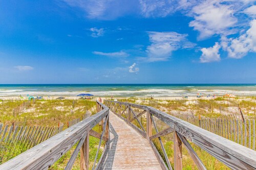 Dog-friendly townhome in private community with pool - near beach