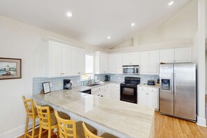 Fridge, microwave, oven, stovetop - Beachfront home with a pool, game room, deck, grill, washer&dryer & central AC (St. George Island)