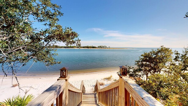 A wooden staircase leading to a beach with a clear view of the water and distant land. - Dog-friendly oceanfront home with a hot tub, washer&dryer & central AC (Cape San Blas)