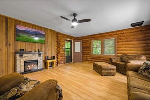 TV, fireplace, table football - *Secluded 2BD Cabin w/ Hot Tub! Fireplace + GAMES* (Sevierville)