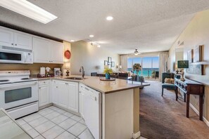 Fridge, microwave, oven, stovetop - Stunning, waterfront home with Gulf views, pool & fitness room access (Destin)