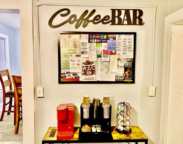 A wall with a 'Coffee BAR' sign and a bulletin board with various notices and advertisements. - Downtown Roanoke with Home Theatre (Roanoke)