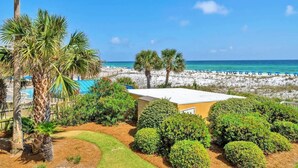 A resort with a pool, palm trees, and a beach view. - Azure 202-Newly Refreshed 2026 (Fort Walton Beach)