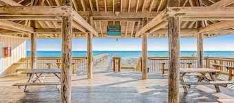 Stylish waterfront condo with pools, hot tubs, private beach, & sports courts