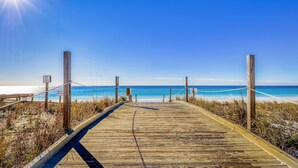 A wooden boardwalk leading to a beach with a clear sky and ocean view. - Sparkling Studio with Shared Pools, Hot Tubs, Golf, Tennis, & a Private Beach (Destin)