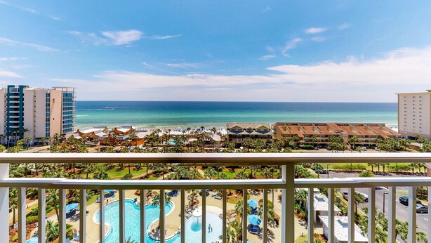 A resort with a pool, beach, and ocean view. - Captiva beachfront condo w ocean views and pool & fitness center access (Destin)