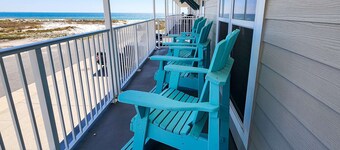 2nd-floor ocean-view condo with balcony, washer/dryer, & AC - close to the beach