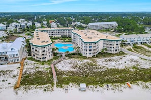 A resort with a central pool, multiple buildings, and a beach area. - Dunes of Seagrove condo with pool, hot tub, sauna, gym, & tennis,pickleball (Santa Rosa Beach)