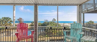 Beachfront home with screened porch with boardwalk access to pool
