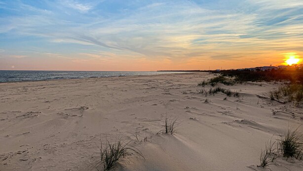 A beach with sand dunes and sparse vegetation. - Dog-friendly home near the beach with spacious living area, porch & sundeck (Port St. Joe)