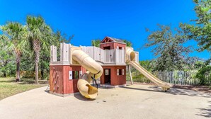 A playground with a slide and climbing structure. - Dog friendly home and casita with pool plus beach access, central AC, and laundry (Port St. Joe)