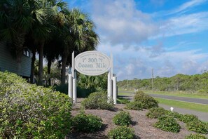 A sign indicating 300 miles to Ocean Mile, St. George Island, Florida.